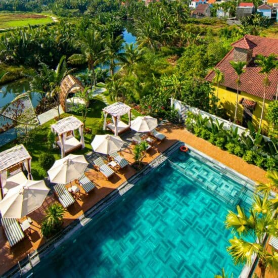 Essential Vietnam Trio Pool & chair loungers at the Shinning Hotel Essential Hoi An feature Essential Vietnam Trio